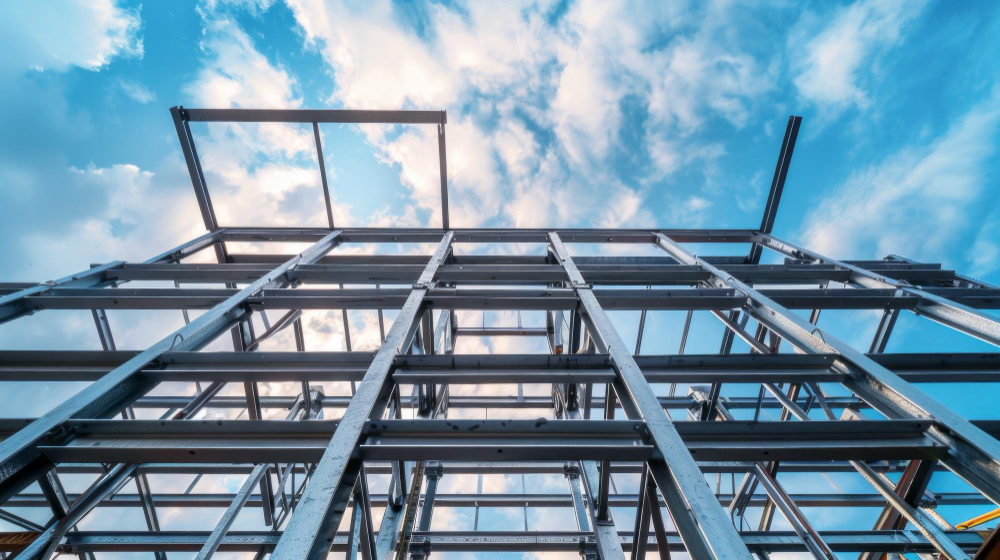 Looking up through a steel frame to the sky